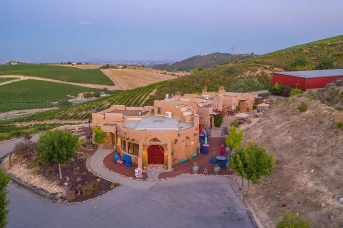 The winery's round, Kiva-style tasting room addition, with the square annex at left, both designed by S² Architecture.